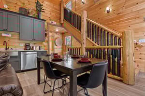 open concept layout with table for 4