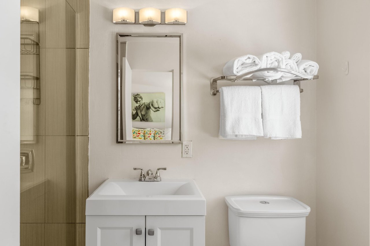 Ensuite bathroom in the primary bedroom with a walkin shower.