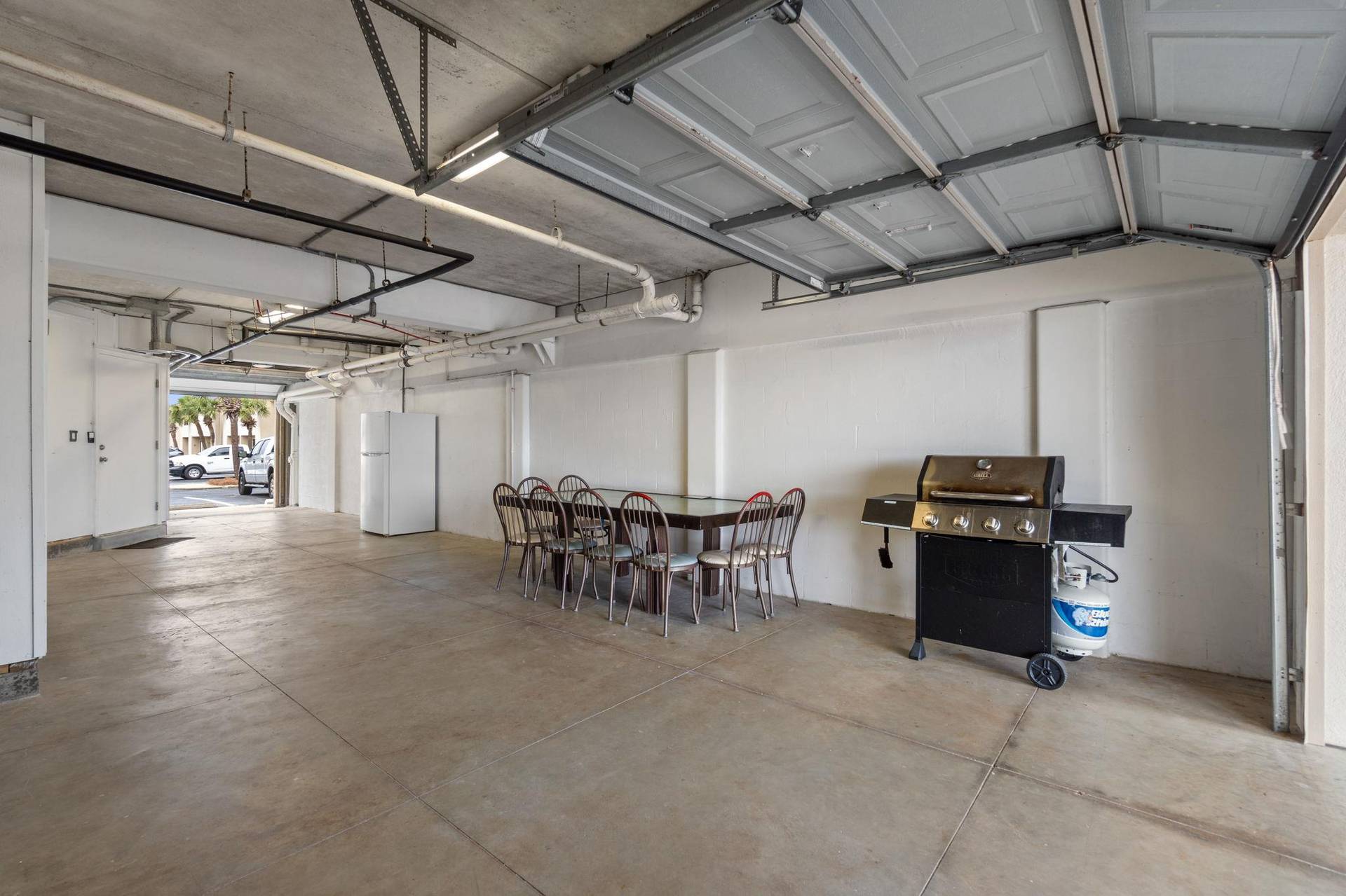 Garage With Plenty Of Seating, Grill,  Extra Fridge
