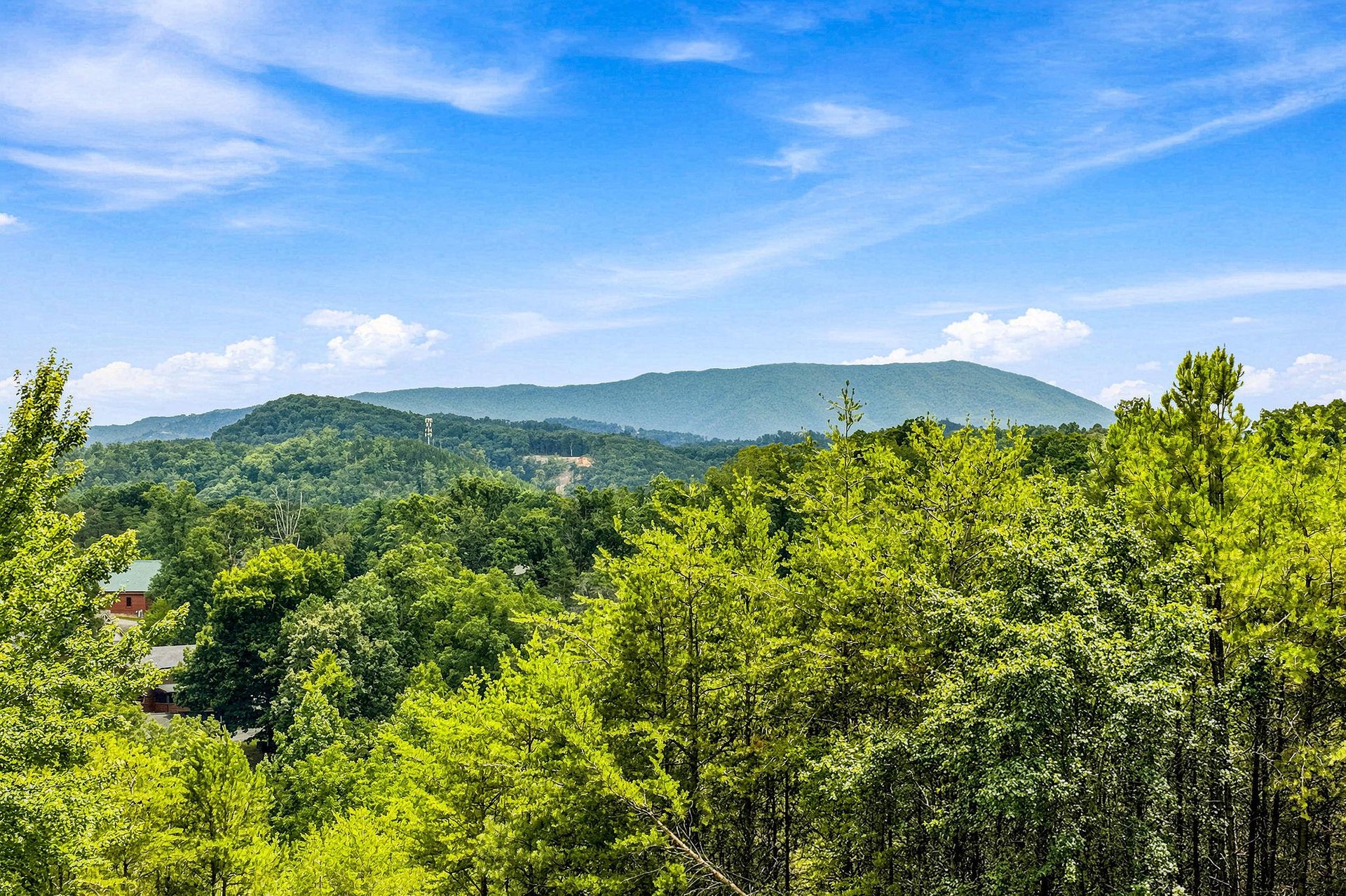 Stunning mountain scenery surrounds the property, with lush forests and rolling peaks creating a peaceful natural backdrop in every direction.