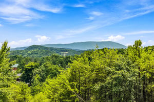 Stunning mountain scenery surrounds the property, with lush forests and rolling peaks creating a peaceful natural backdrop in every direction.