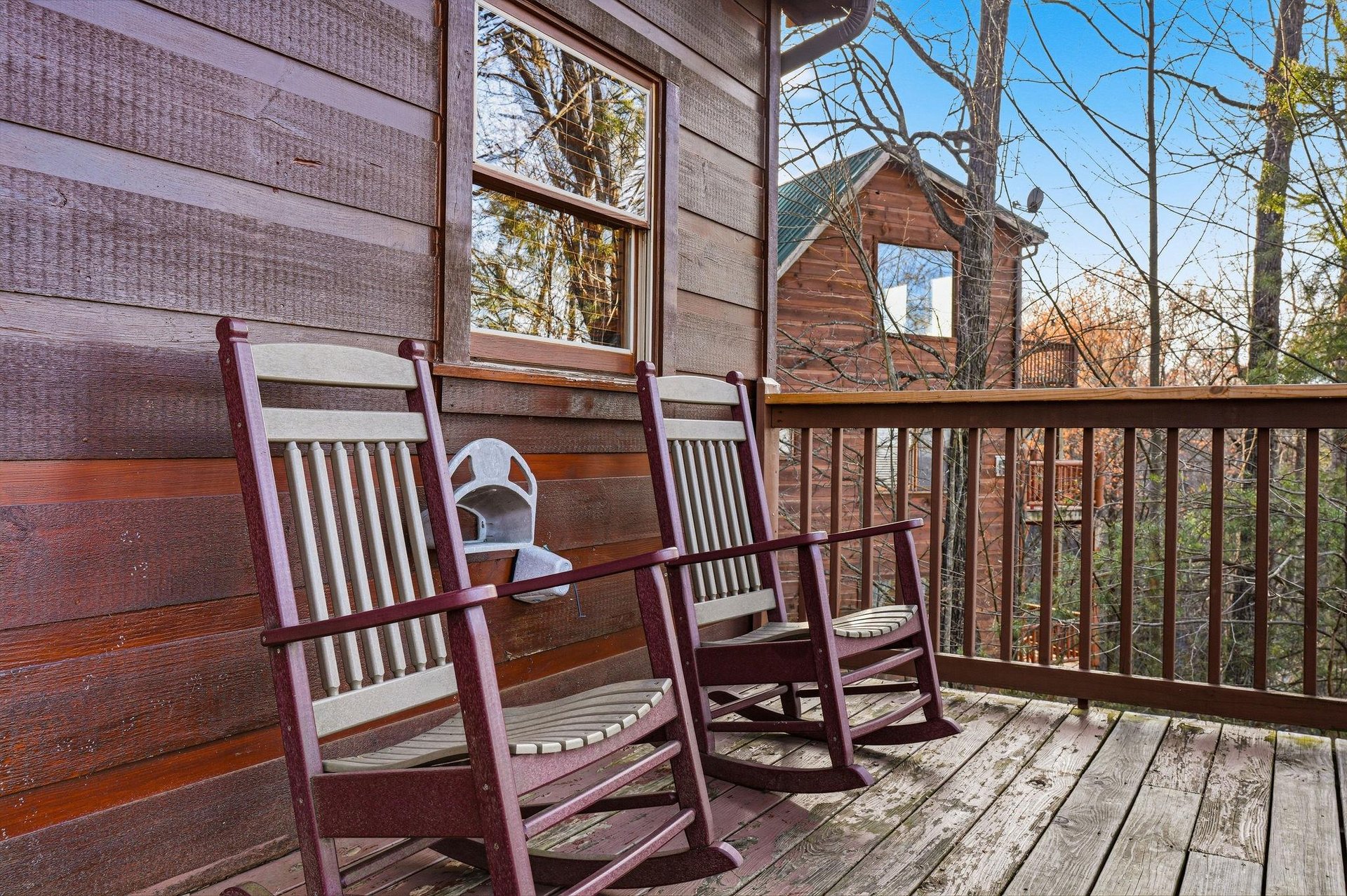 Unwind in your private rocking chairs on this peaceful deck, where youll sip morning coffee while watching sunlight dance through towering trees.