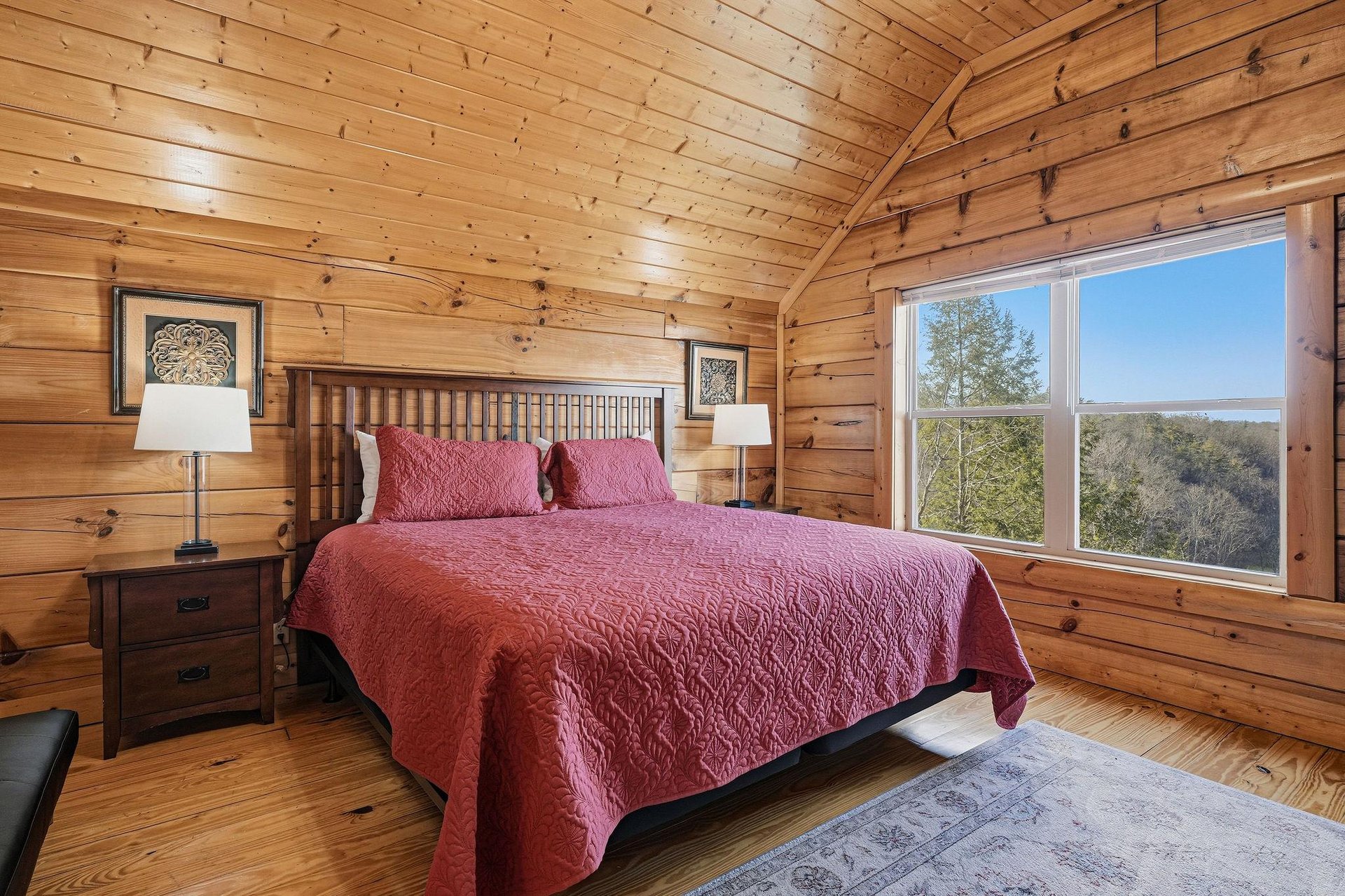 Drift off to sleep surrounded by warm wood walls with natural light streaming through your window overlooking peaceful treetops.
