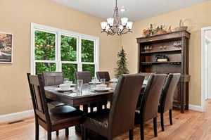 Gather around this elegant dining table for memorable meals together, with natural light streaming through large windows and all the space your group needs to relax and connect.