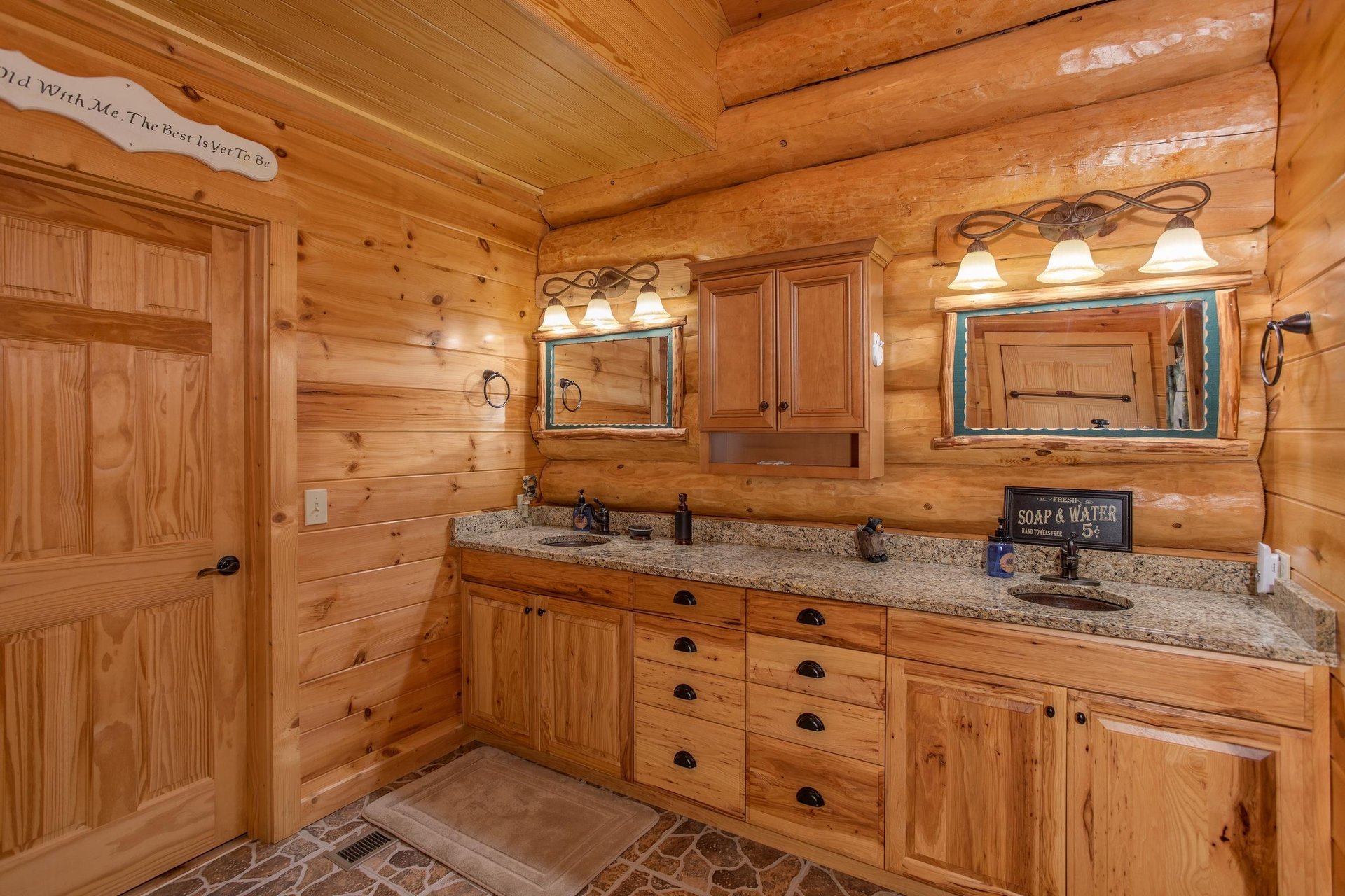 En suite bath on the main floor with double vanity sinks at Great View Lodge, a 5bedroom cabin rental located in Pigeon Forge