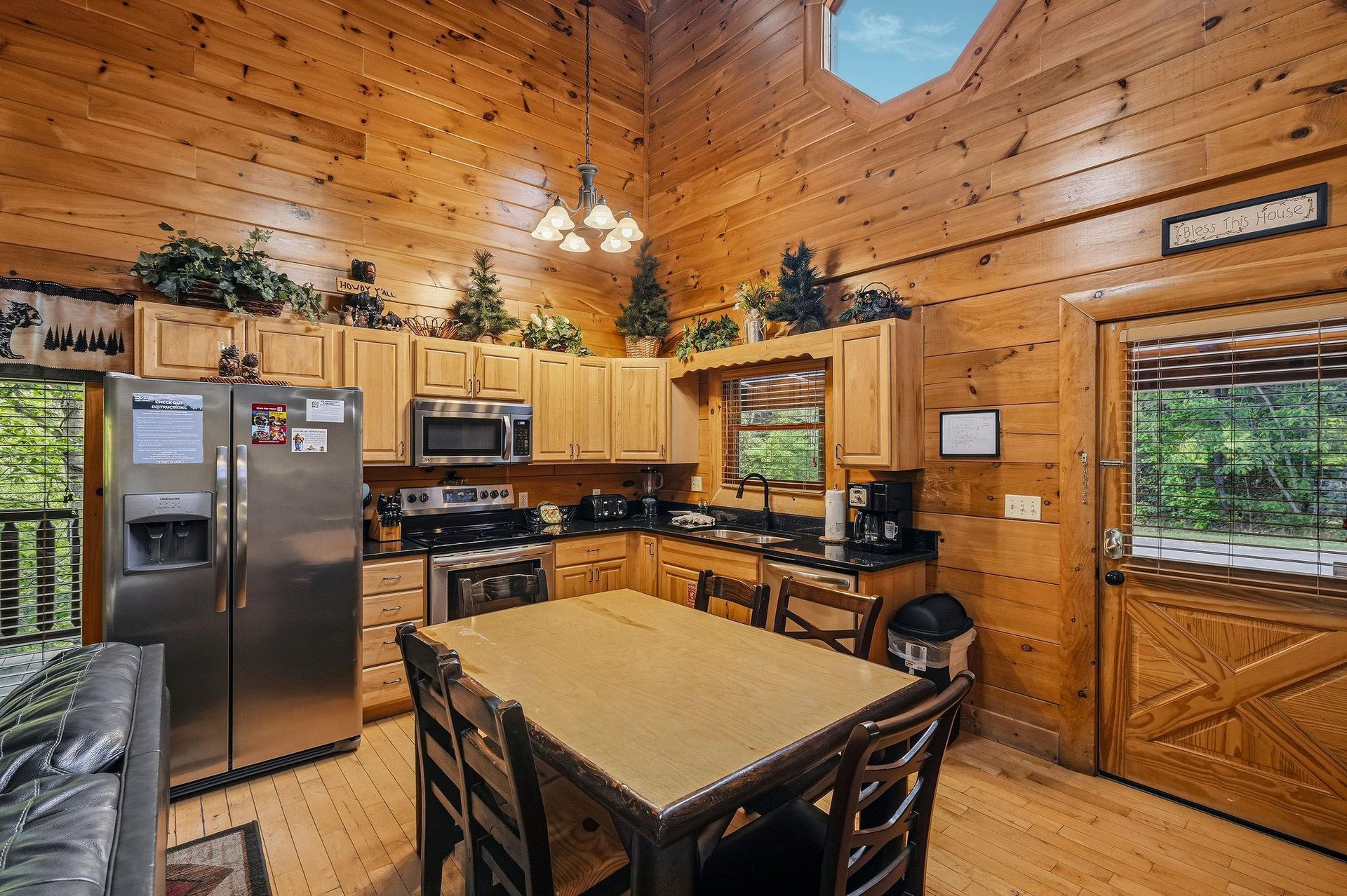 Gather around your spacious kitchens dining table where rustic charm meets modern convenience, surrounded by warm wood and natural light.