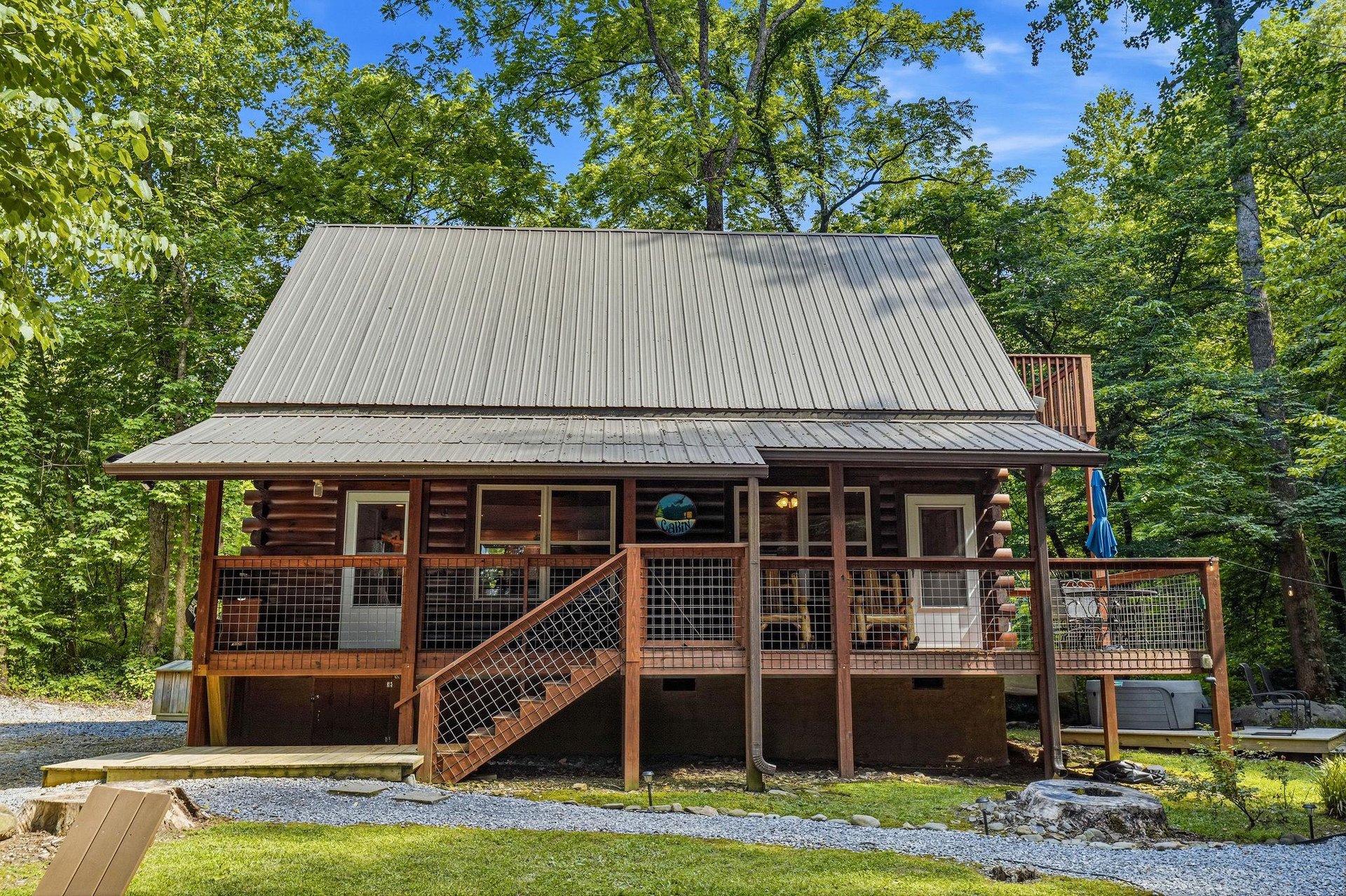 Rustic log cabin exterior nestled in a lush forest setting, offering a peaceful retreat surrounded by mature trees and natural beauty.