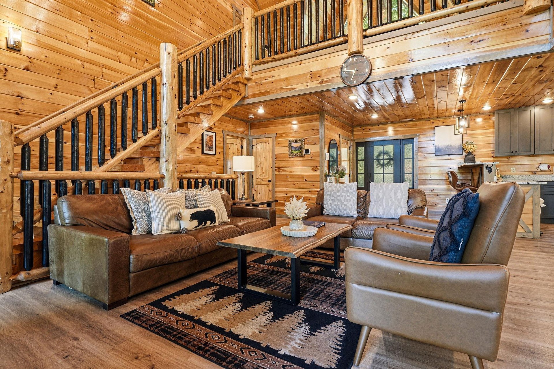Sink into plush leather seating surrounded by warm wood walls and rustic charm. Your mountain retreat awaits with cozy textures and inviting ambiance.