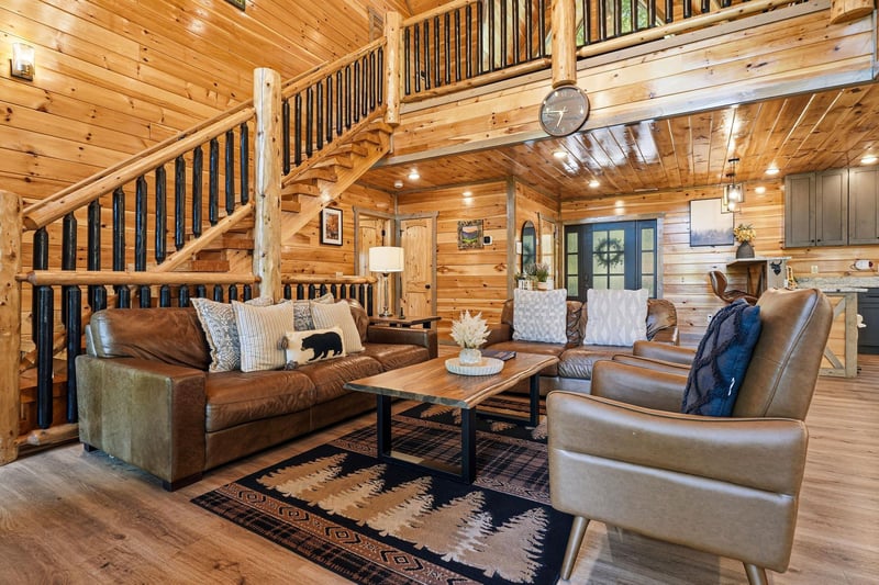 Sink into plush leather seating surrounded by warm wood walls and rustic charm. Your mountain retreat awaits with cozy textures and inviting ambiance.