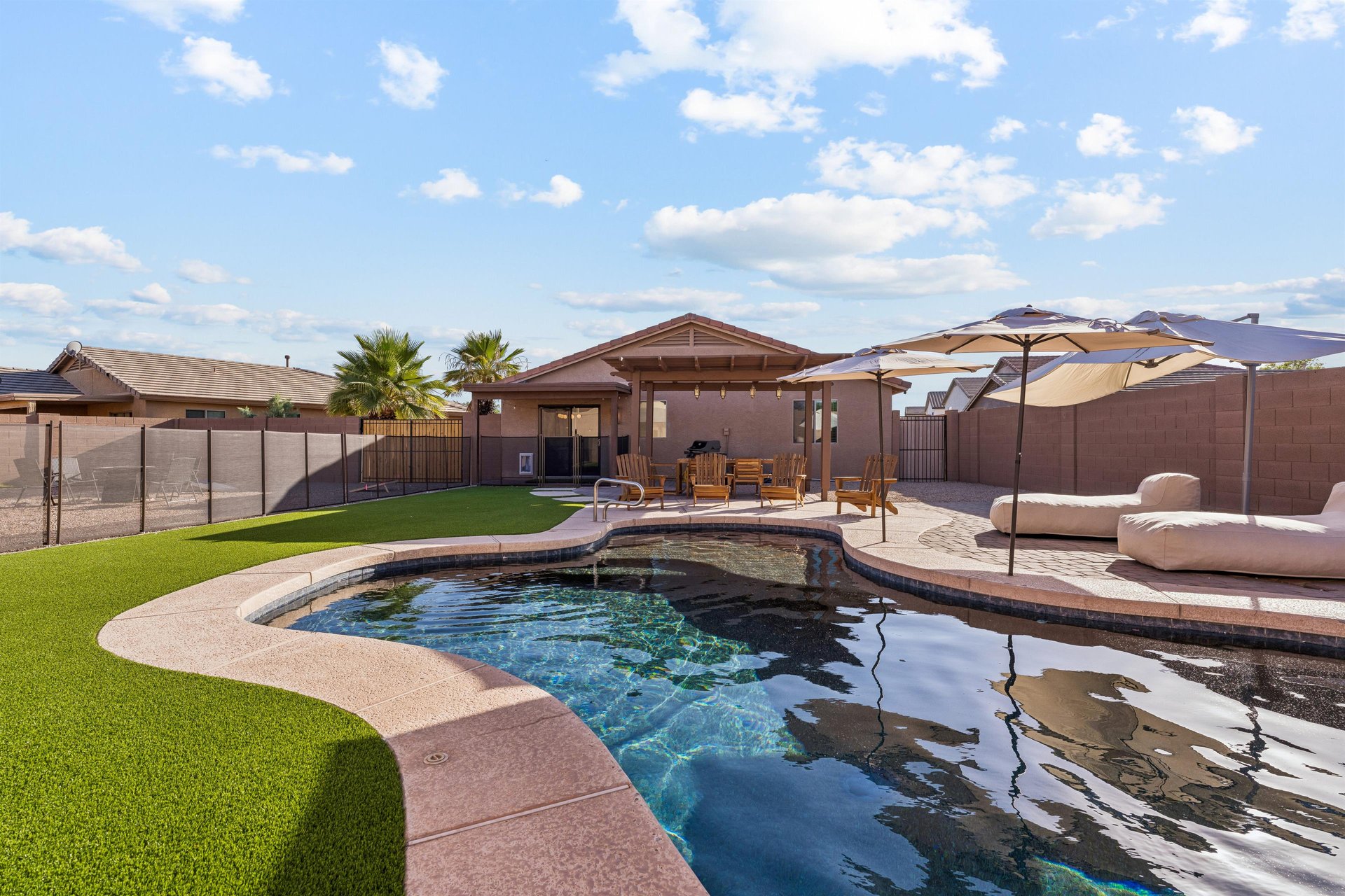 Private pool, sun loungers, patio with outdoor dining space, BBQ, firepit, and corn hole.