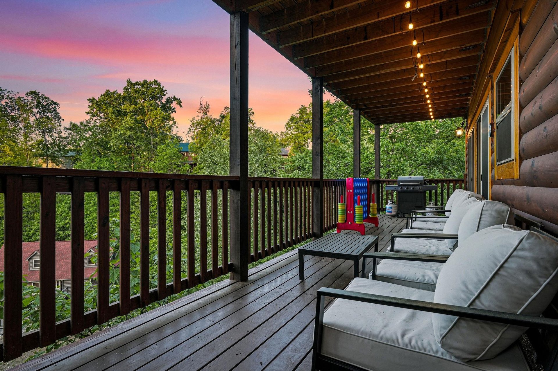 Unwind on your private covered deck with comfortable seating while enjoying stunning sunset views over the treetops.
