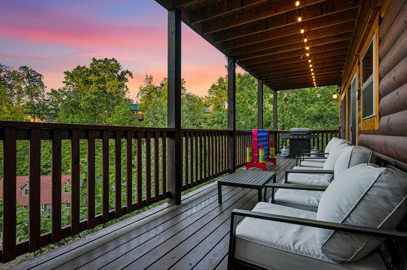Unwind on your private covered deck with comfortable seating while enjoying stunning sunset views over the treetops.