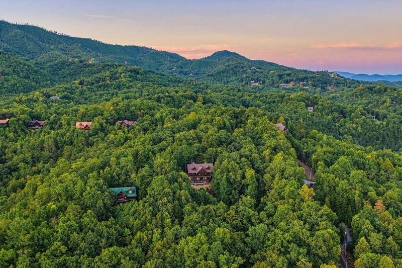 Nestled among lush Smoky Mountain forests, the property offers peaceful seclusion while remaining close to neighboring cabins and scenic hiking trails.