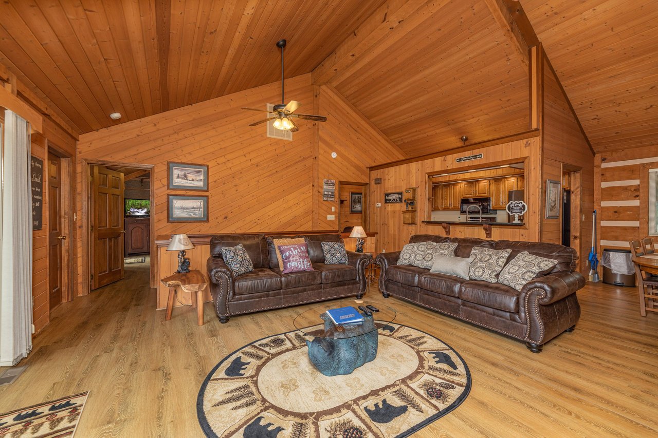 Two sofas in a living room at Cubs Crib, a 3 bedroom cabin rental located in Gatlinburg