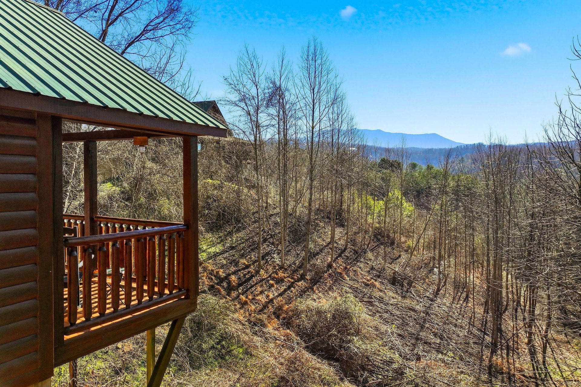 Stunning mountain vistas stretch endlessly from your private elevated deck, where peaceful mornings and breathtaking sunsets await your arrival.