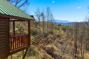 Stunning mountain vistas stretch endlessly from your private elevated deck, where peaceful mornings and breathtaking sunsets await your arrival.