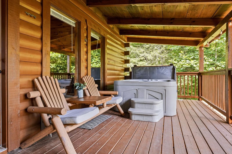 Unwind in your private Adirondack chairs with a hot tub just steps away, surrounded by serene forest views from this covered deck.
