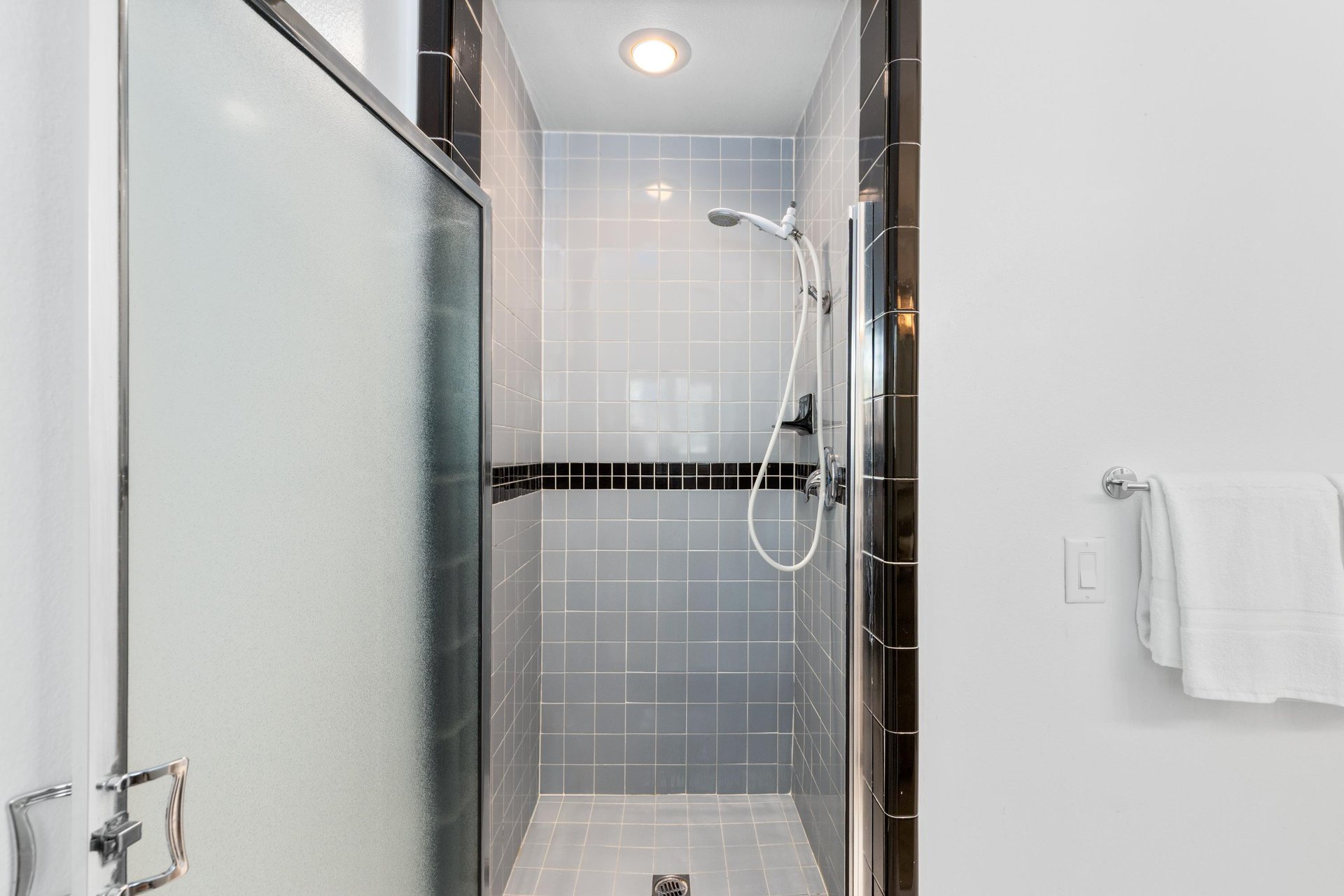 View of stand alone shower and detachable shower head.