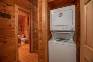 Stacked washer and dyer at Logans Smoky Den, a 2 bedroom cabin rental located in Pigeon Forge