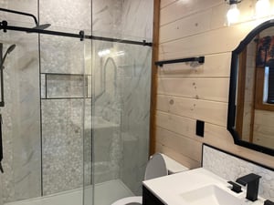 Refresh in your stylish bathroom featuring a spacious glass shower, modern fixtures, and beautiful tile work that creates a spalike retreat.