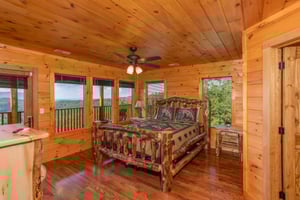 Queen Bedroom with a Log Bed and Deck Access