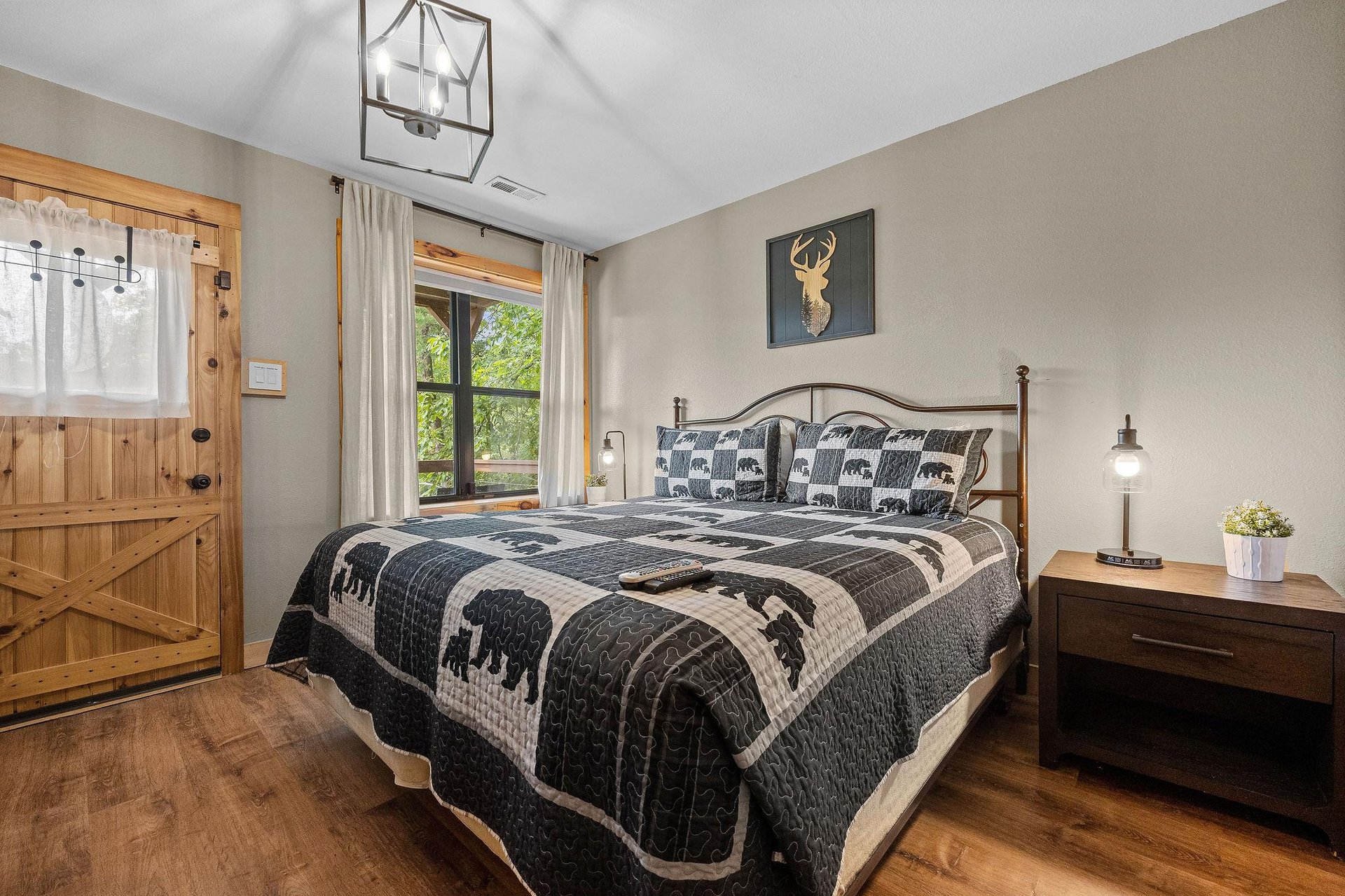 King bed with window and door to deck