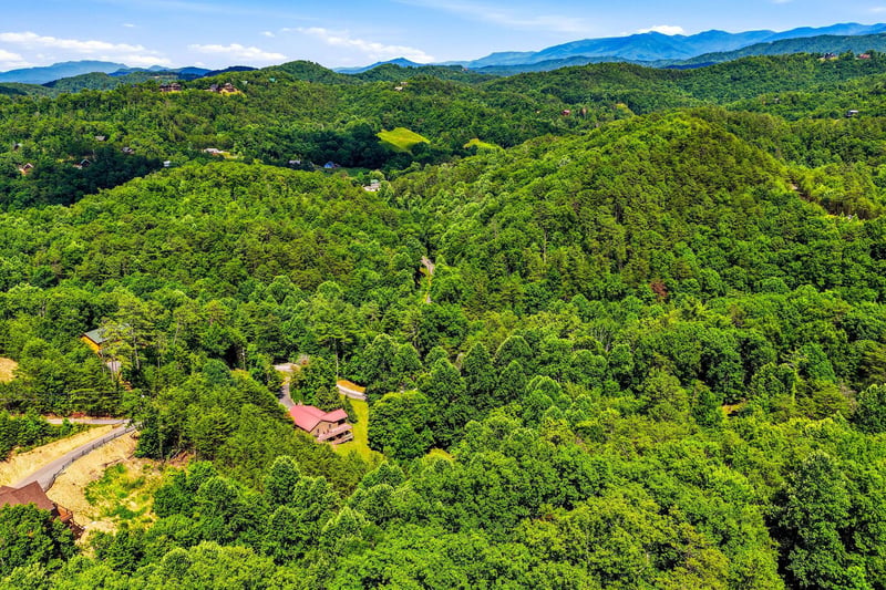 Nestled among lush forested hills and stunning mountain views, this property offers a secluded retreat with access to scenic trails and natural beauty.