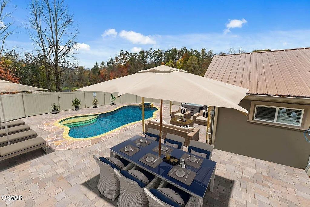 Step out to your private backyard oasis with sparkling pool and shaded dining perfect for morning coffee or evening meals.