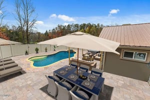 Step out to your private backyard oasis with sparkling pool and shaded dining perfect for morning coffee or evening meals.