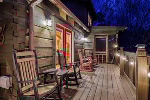 Rocking chairs and deck view at night