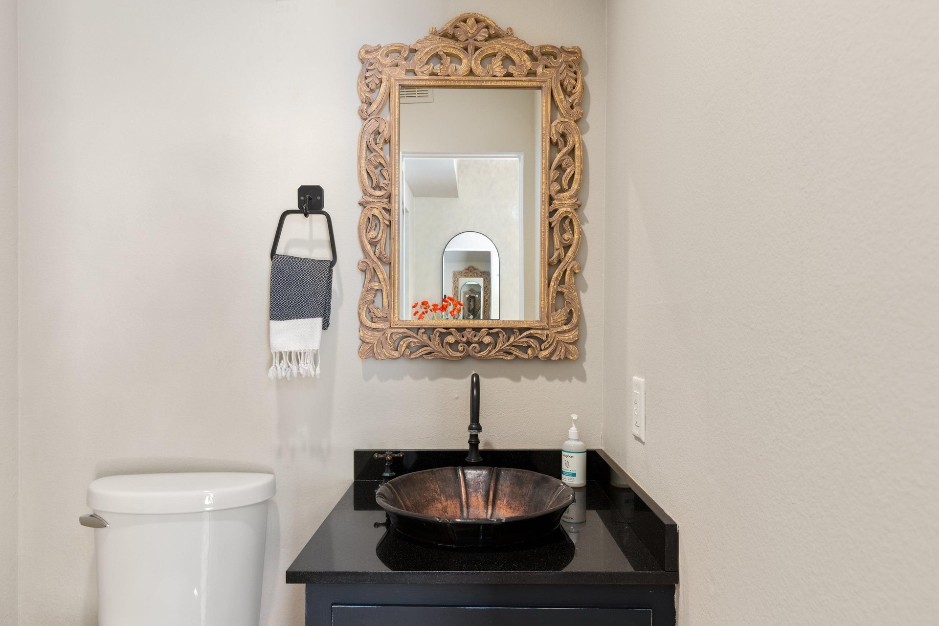 Half bathroom located near entryway.