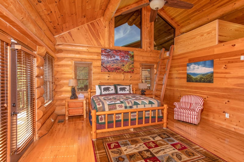 King bedroom with an additional sleeping loft at Great View Lodge, a 5bedroom cabin rental located in Pigeon Forge
