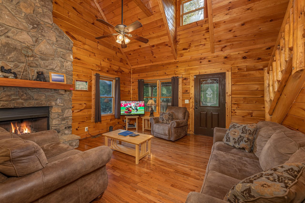 Living room with stone fireplace