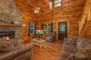 Living room with stone fireplace