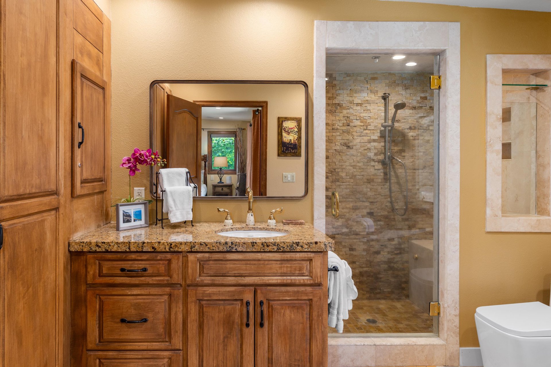 Ensuite bathroom with a standalone shower and tub.