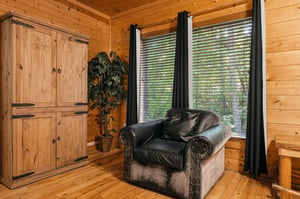 Settle into your cozy corner with warm woodpaneled walls and natural light streaming through the windows, perfect for unwinding after a day of adventure.