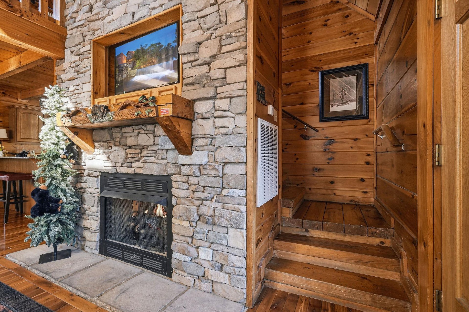 Gather around your stunning stone fireplace where rustic wood meets cozy warmth, creating perfect moments for relaxation.