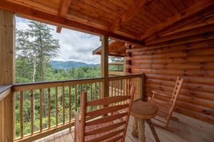 View with outdoor rocking chairs and small table