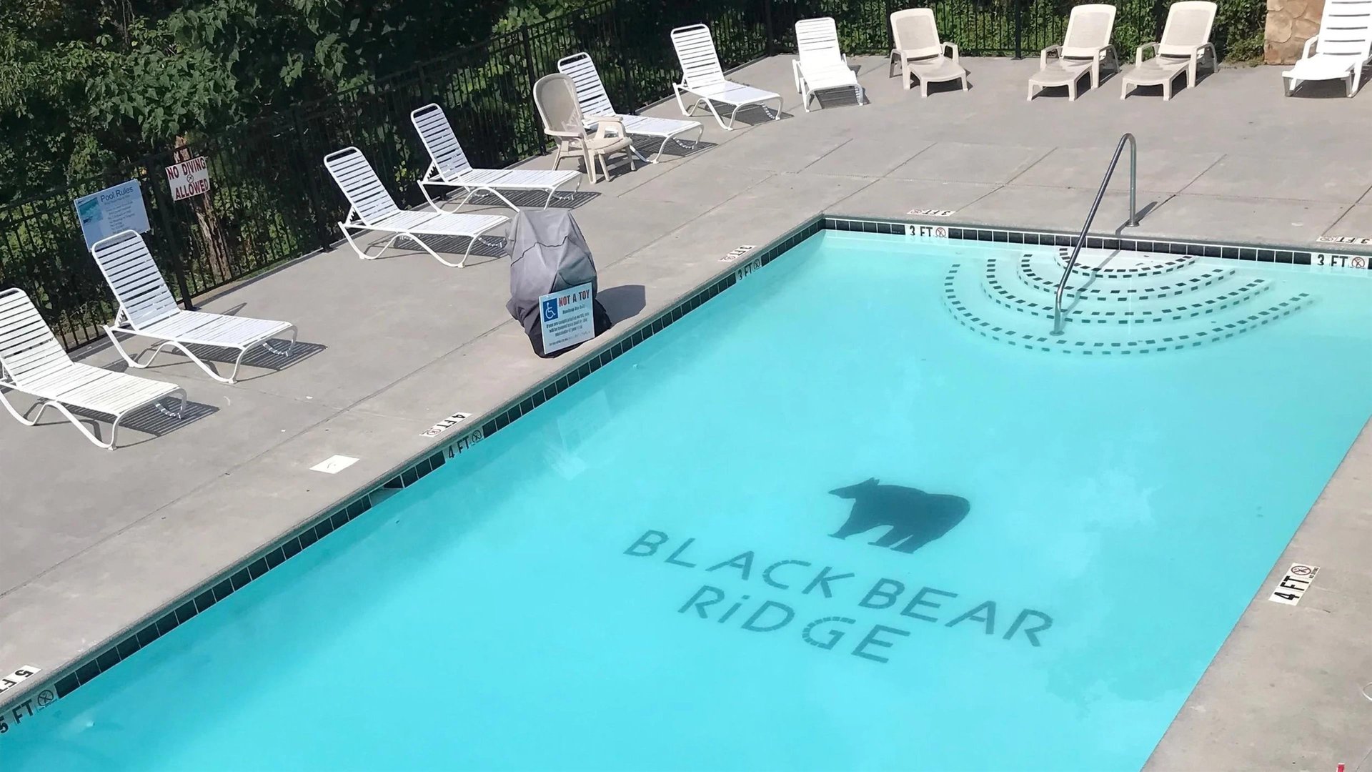 Dive into your private oasis Crystalclear waters await while you lounge poolside on comfortable chairs, surrounded by lush greenery for ultimate relaxation.