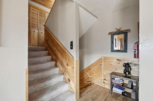 Cozy wooden staircase leads to your private retreat, with charming alpine touches and thoughtful details throughout.