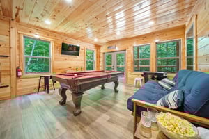 pool table, futon and arcade