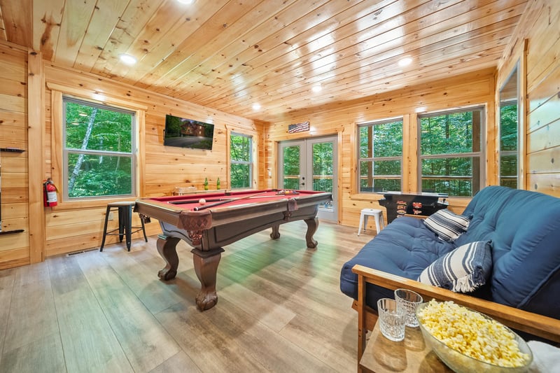 pool table, futon and arcade