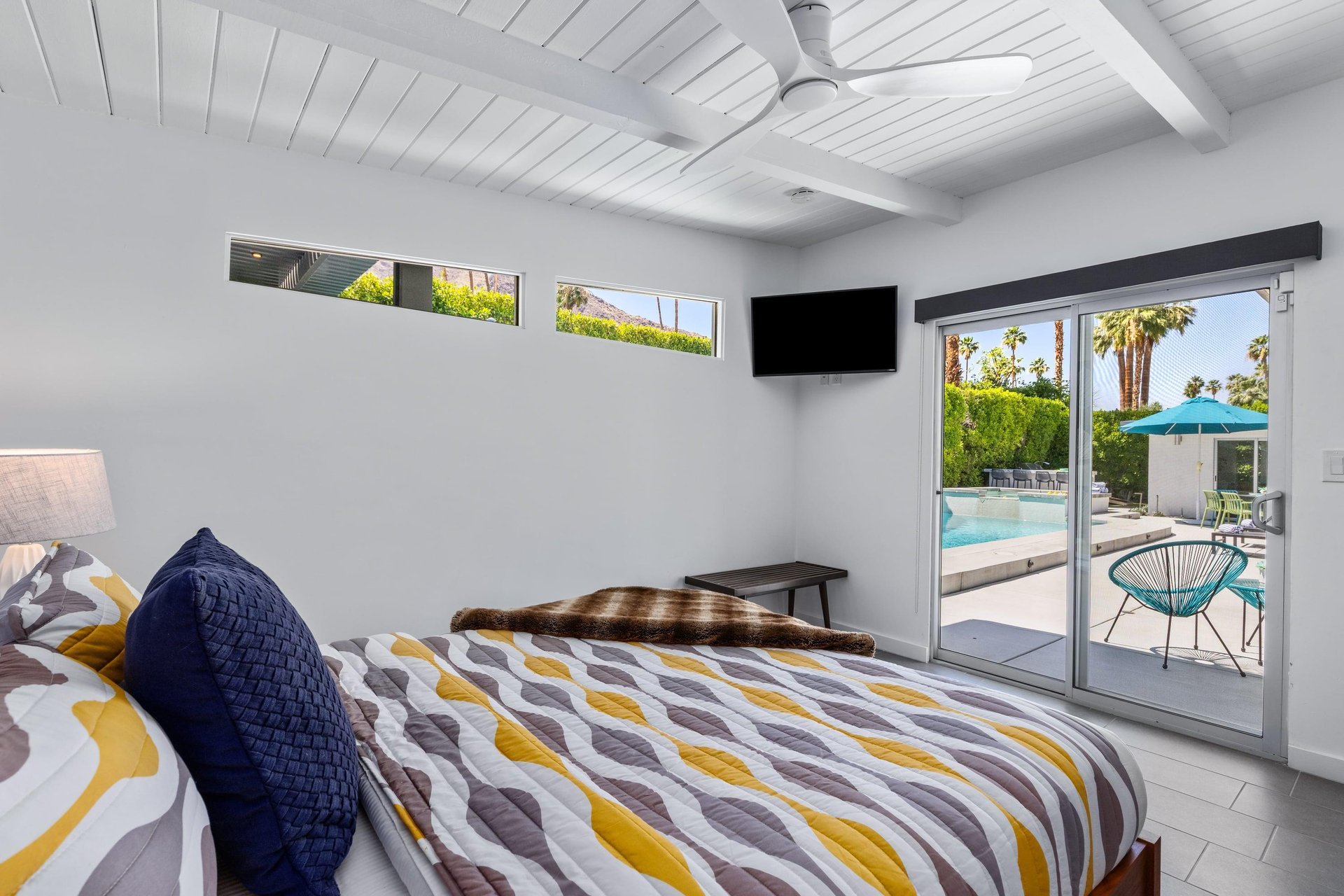 Flatscreen TV and access to the outdoor patio.