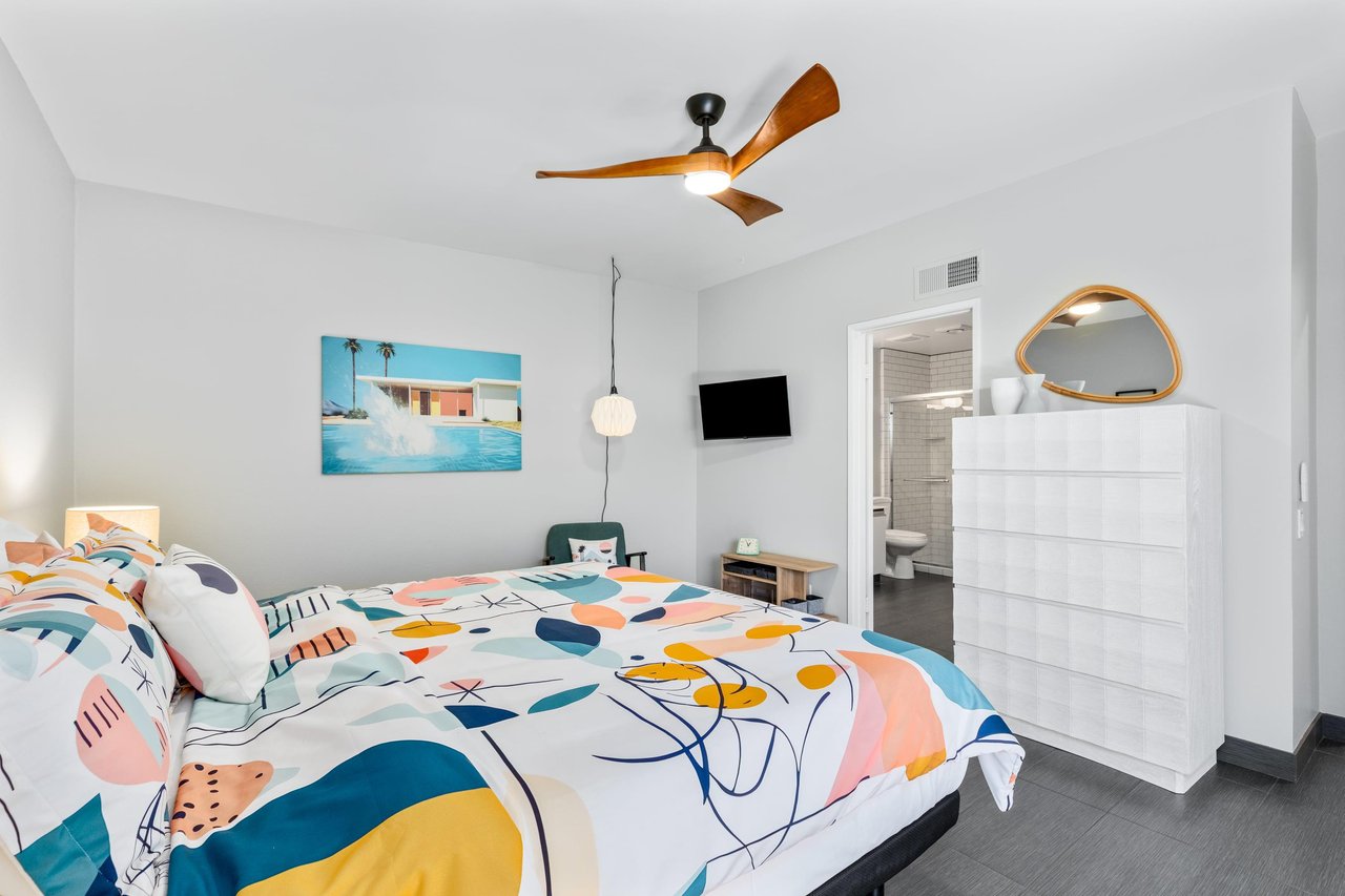 California king bed, smart TV, patio access, and ensuite bathroom.