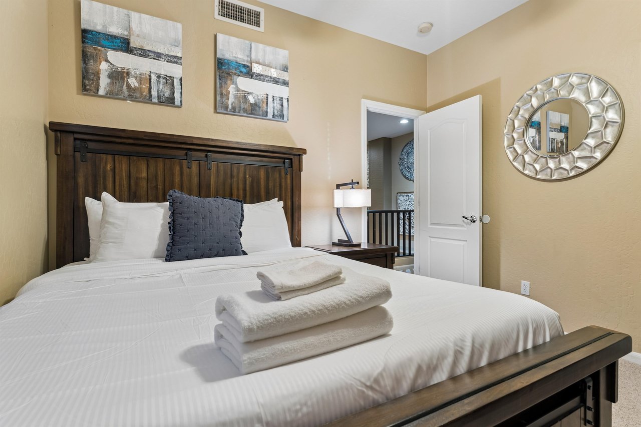 Queen size bed, closet space, and flatscreen TV.