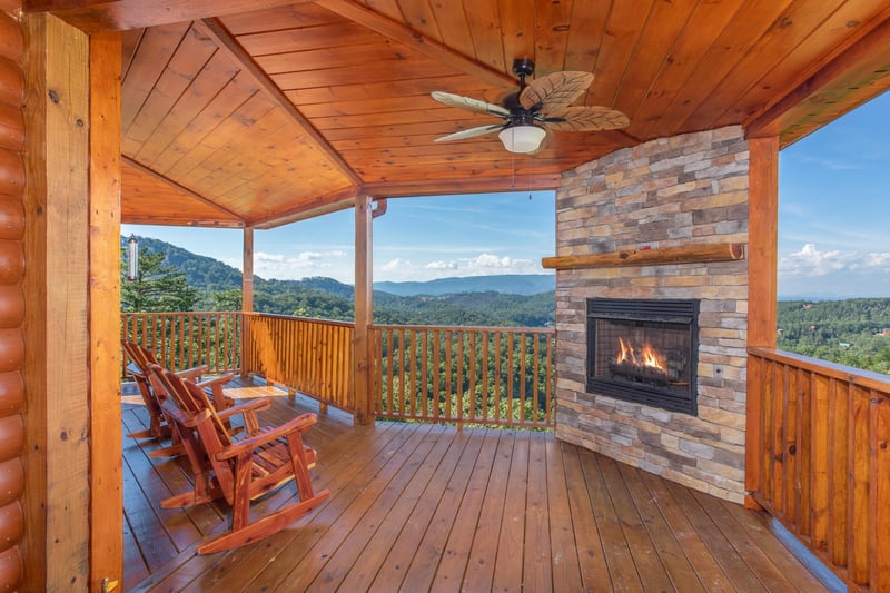 Outdoor fireplace and Rocking Chairs on the Covered Deck