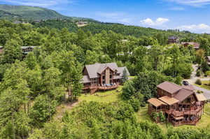 Nestled in the lush mountains, these charming cabins offer a peaceful retreat surrounded by nature. The spacious decks and scenic wooded setting provide an ideal escape from everyday life.