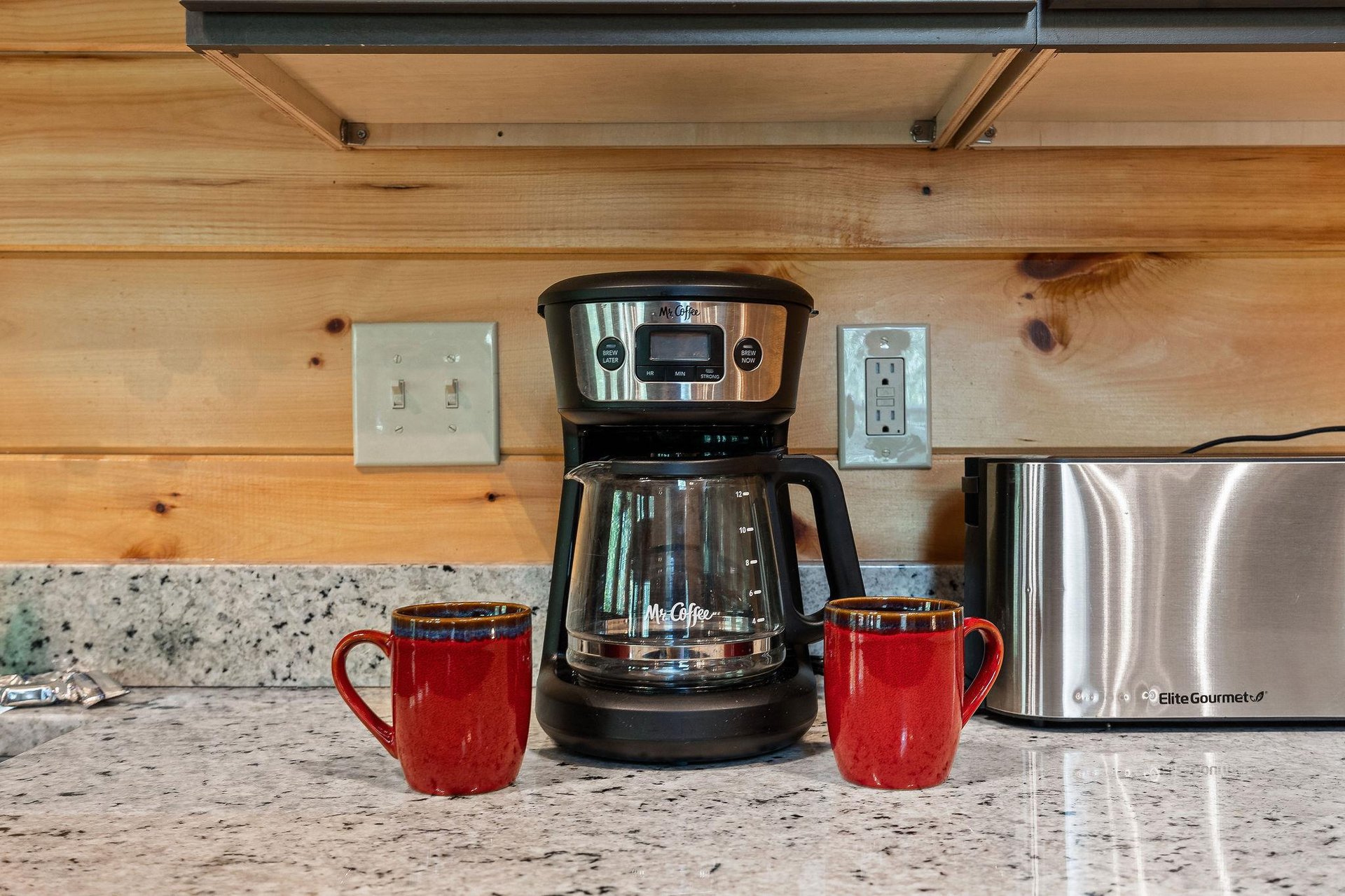 kitchen includes coffee maker and mugs