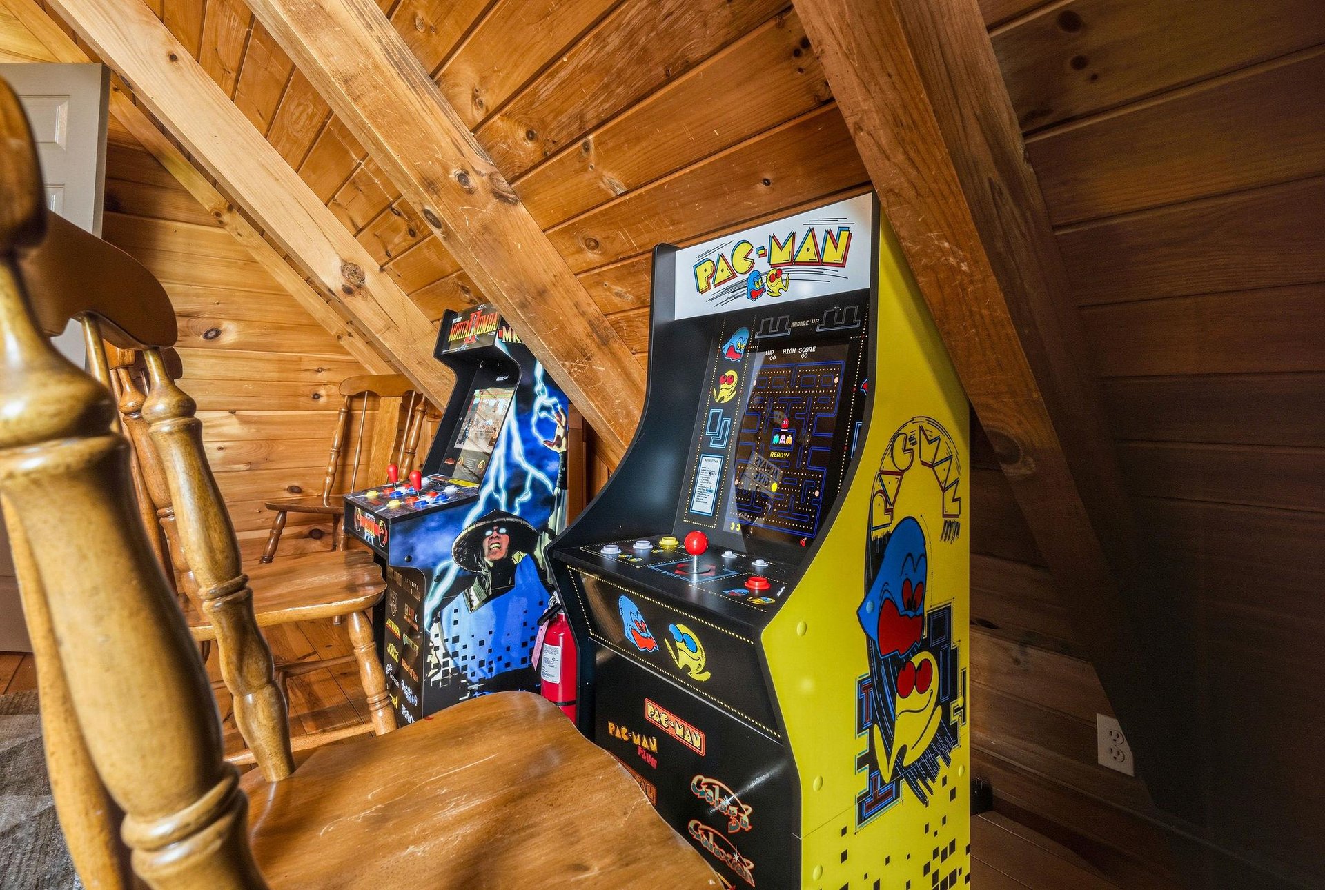 Challenge your friends to classic arcade games in this rustic game loft. Warm wood beams create a cozy retreat where you can relive gaming nostalgia.
