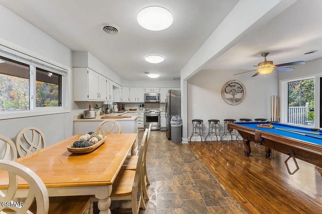 Your spacious retreat combines a fully equipped kitchen, dining area, and game room  perfect for memorable gatherings with family and friends.